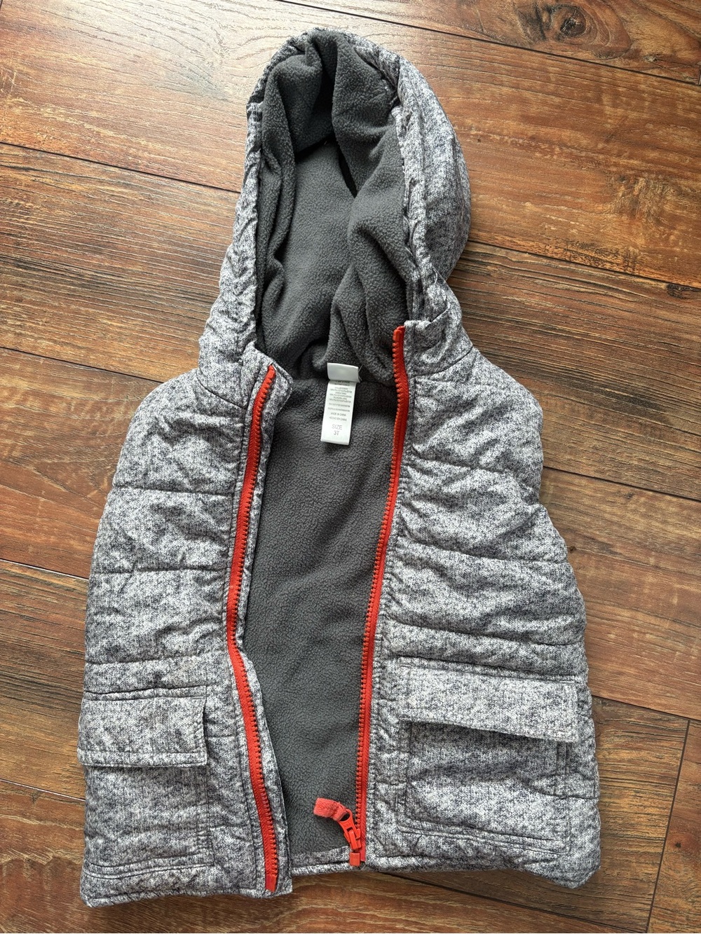 Gray Hooded Quilted Vest with Orange Zipper